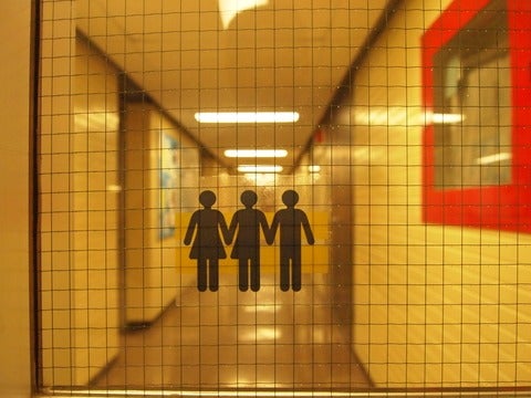 symbols for three or more genders on sticker on glass door