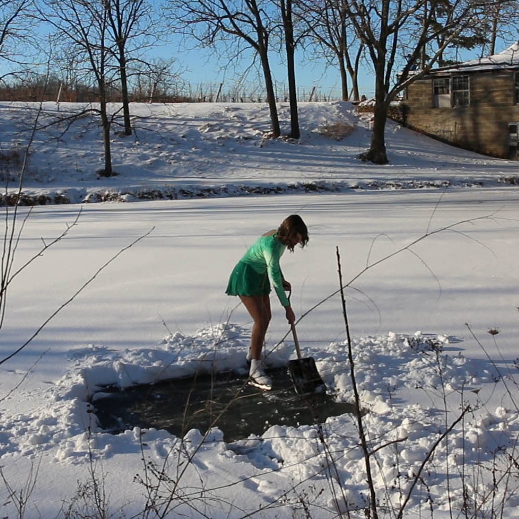 Jordyn Stewart on skates on snowy pond