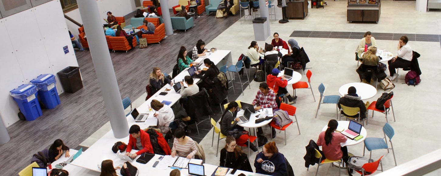 Students working in Hub main floor