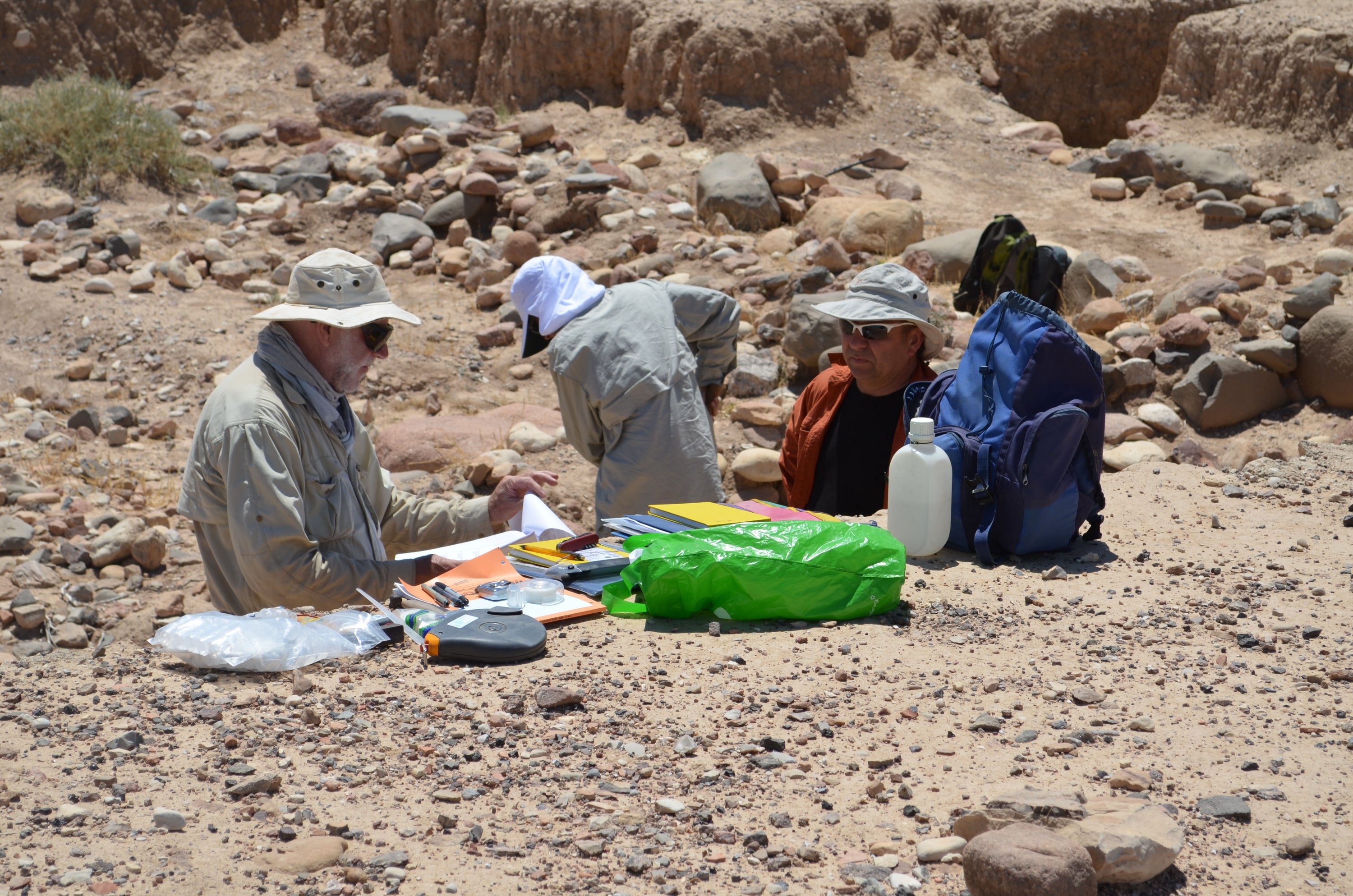    Professor David Gilbertson, UW student Manual Arab and Dr. Keith Haylock examining upper sections at Tell Wadi Faynan.