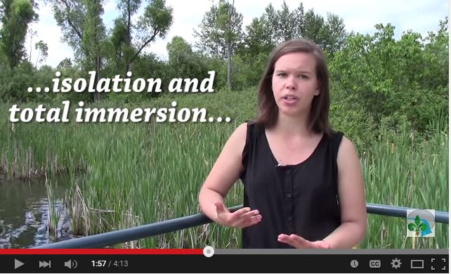 video still of student speaking in nature setting