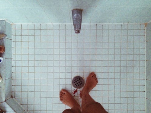 shower with feet and blood drips