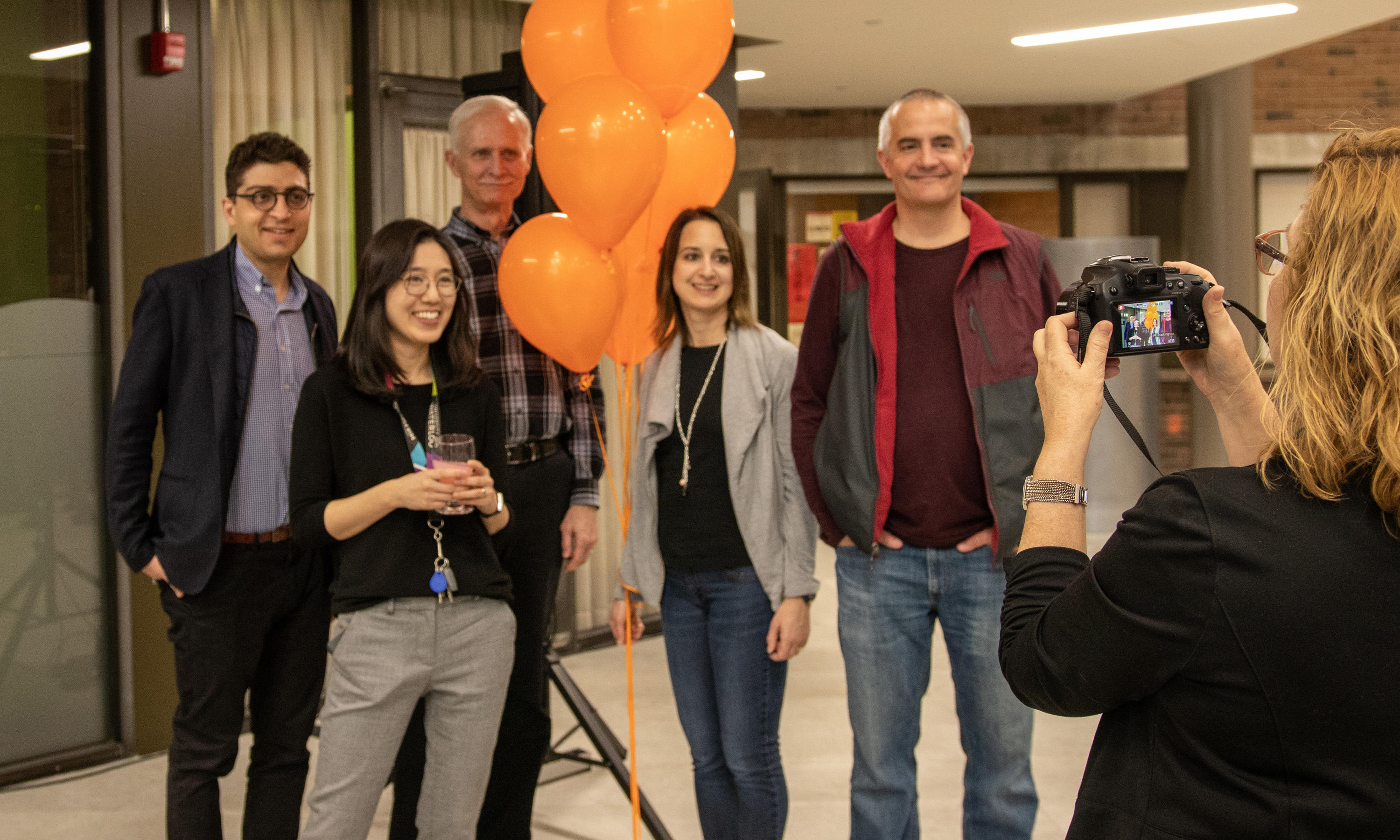 School of Accounting group smile for photographer