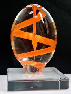 glass sculpture with orange swirl