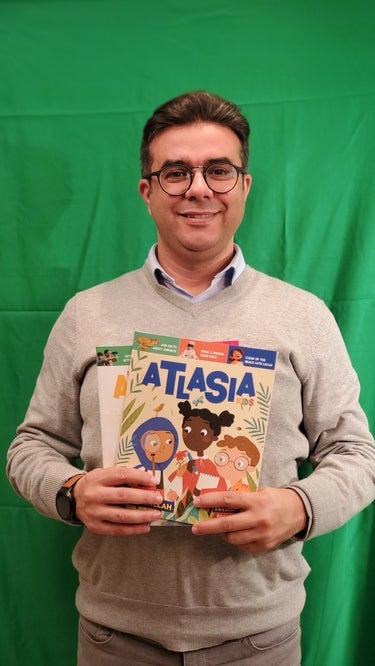 Man posing with a magazine