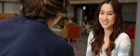 AFM student having coffee with friend