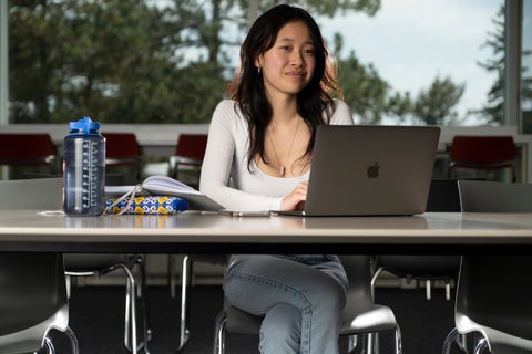 Student at desk with computer