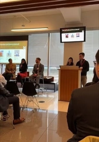 Cormier presenting in front of audience