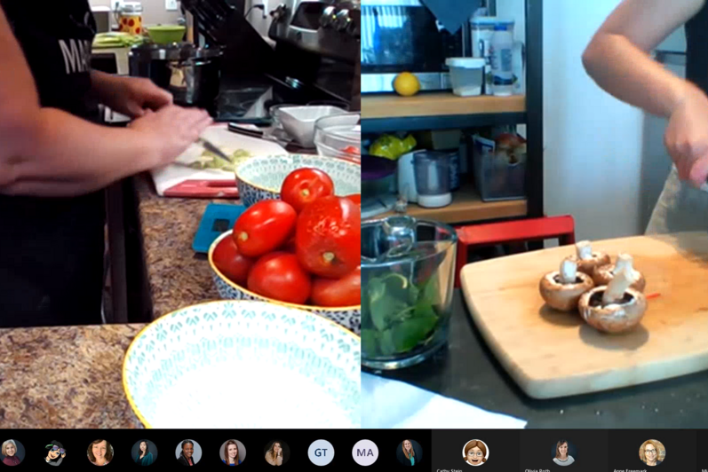 Two staff members chopping veggies during a virtual cooking class
