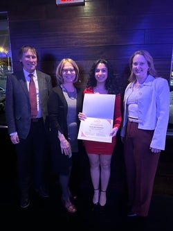 Sarah Bayrakdarian posing with her award along side Judene Pretti, associate provost, CEE