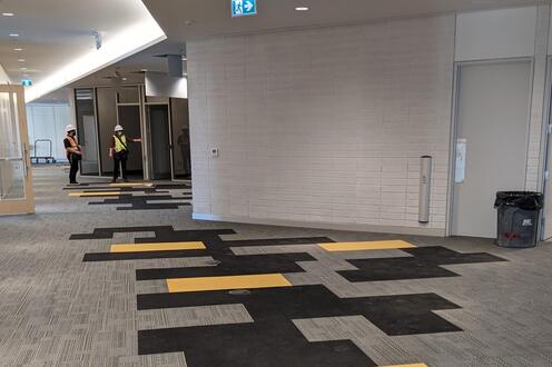 construction space showing the new flooring with black and gold inserts