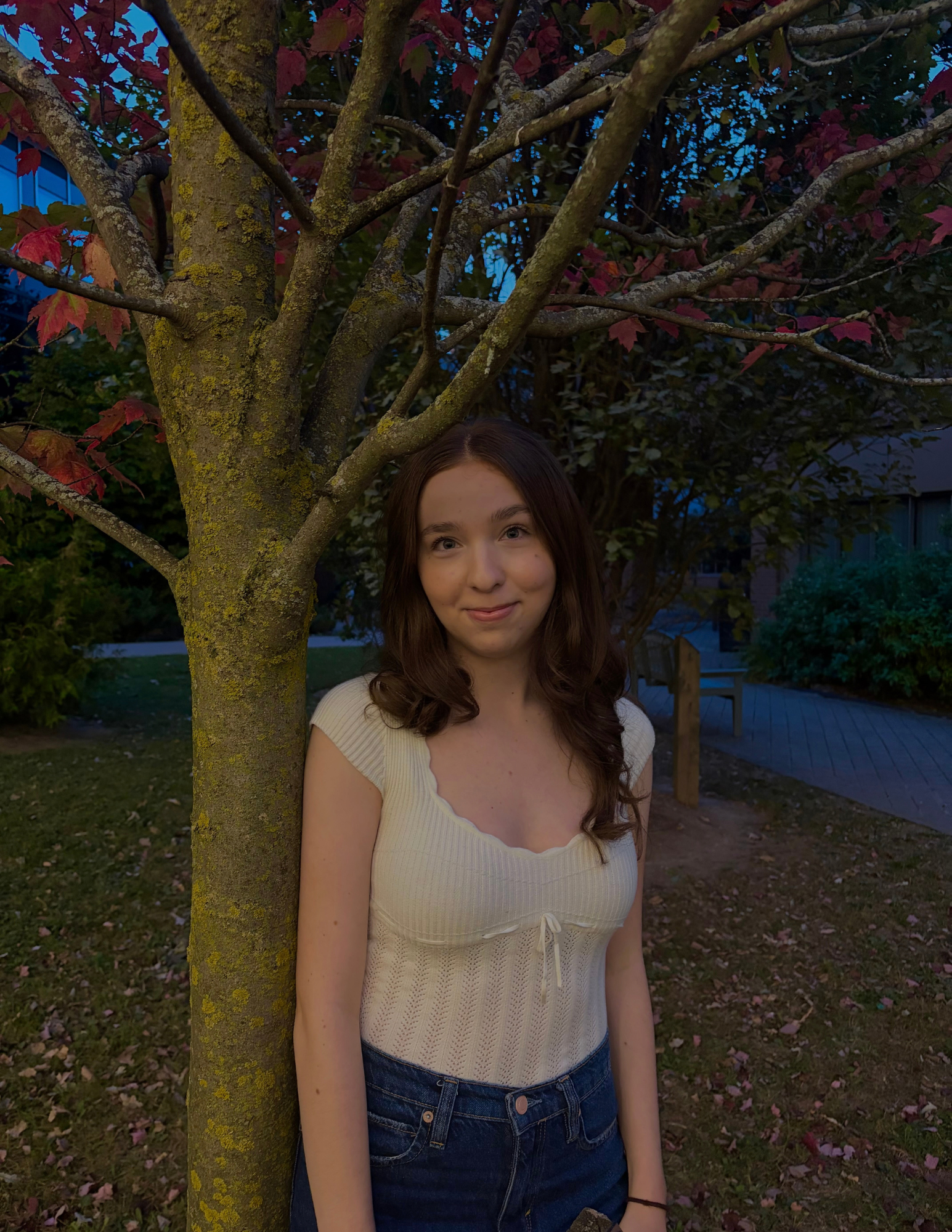 Angelica leaning on a tree