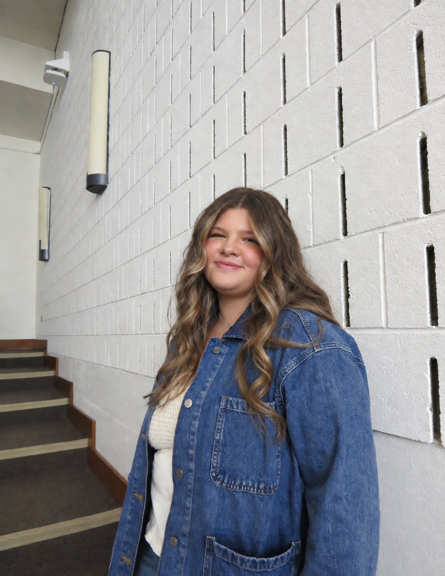 Bailey leaning on a wall