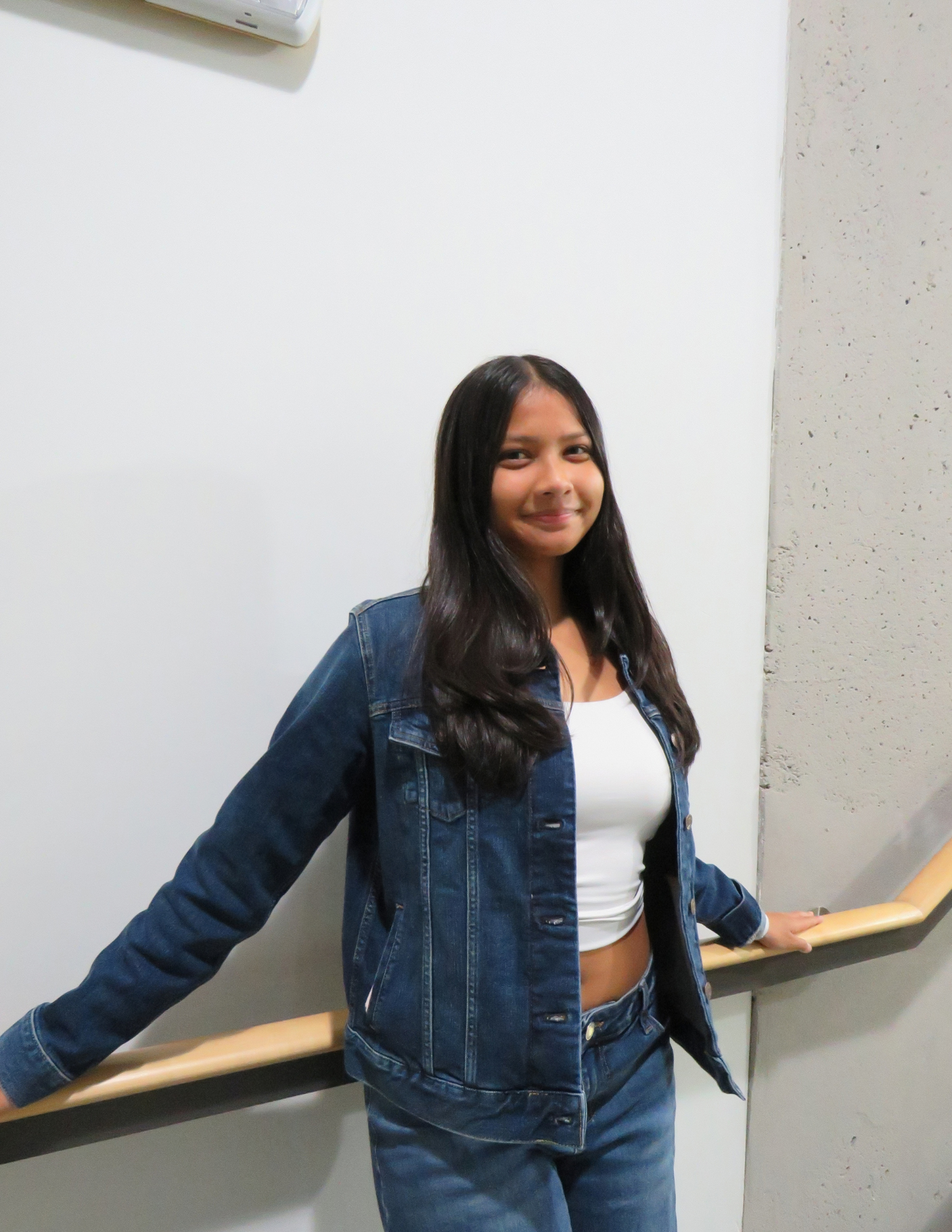 Layla leaning against a wall