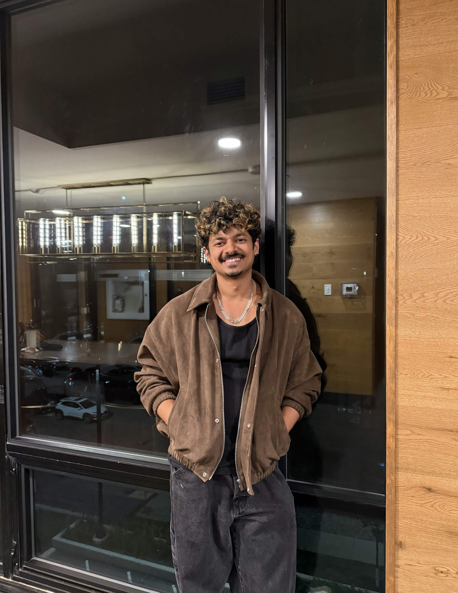 Shiv posing in front of a window