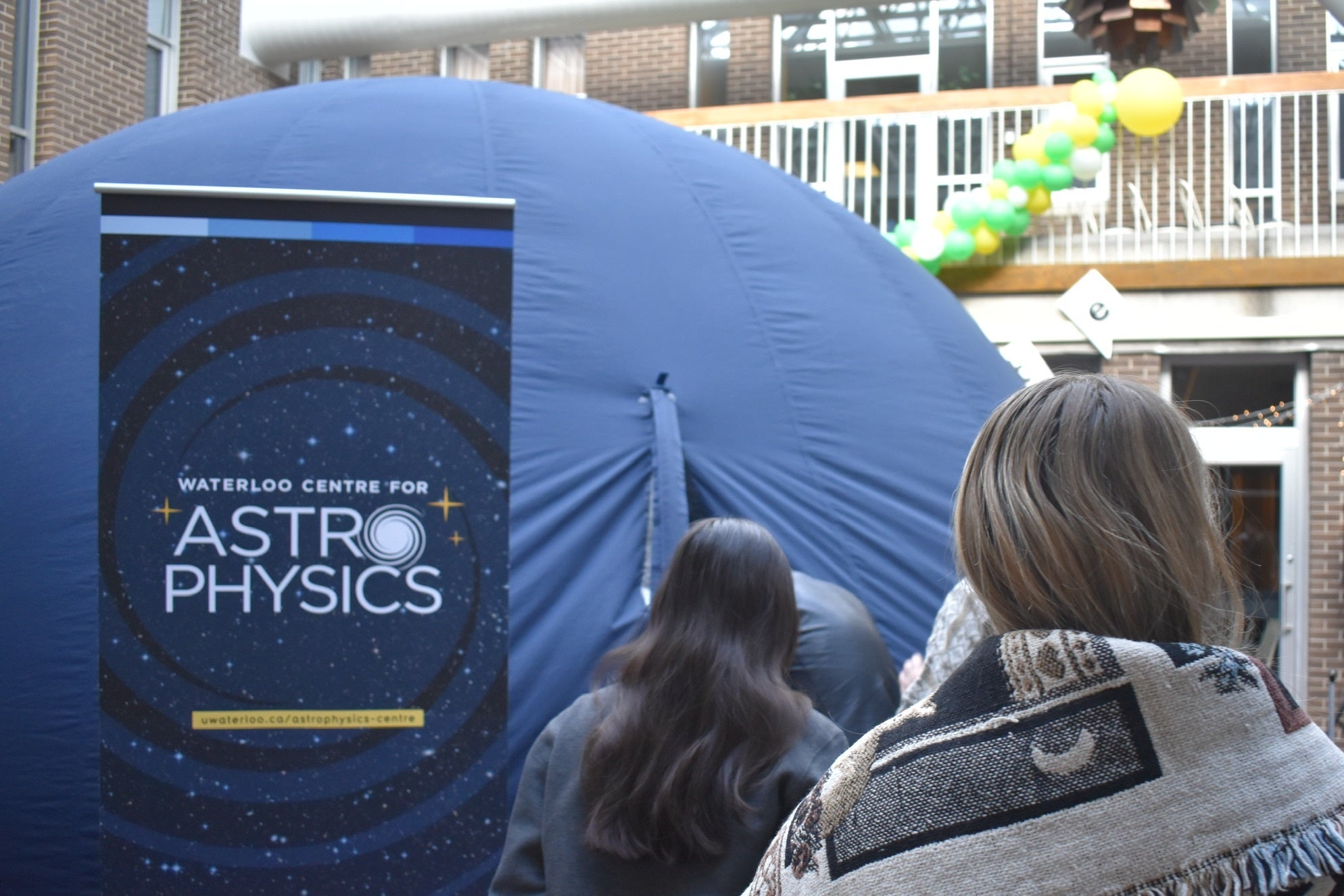 People walking into the Astro-Bubble at ENVigorate 2025