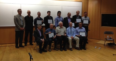 Audio Research Group photo holding awards