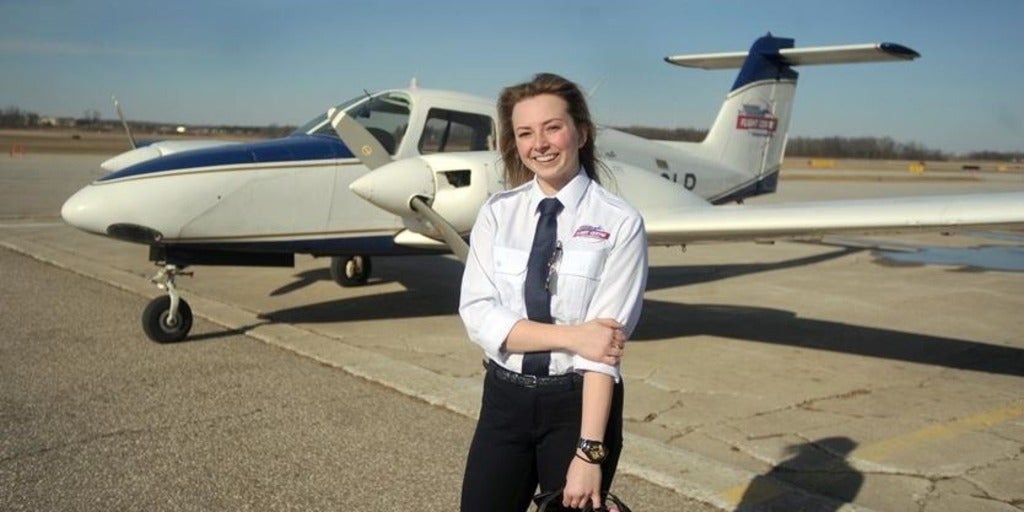 Jodie Scarrow in front of a plane.