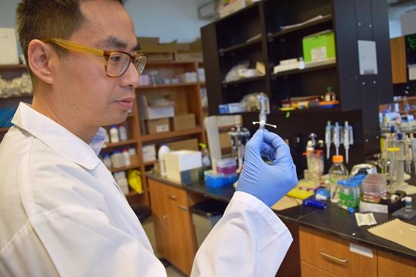 CBB Member Emmanuel Ho, Pharmacy,displays new HIV prevention implant for women