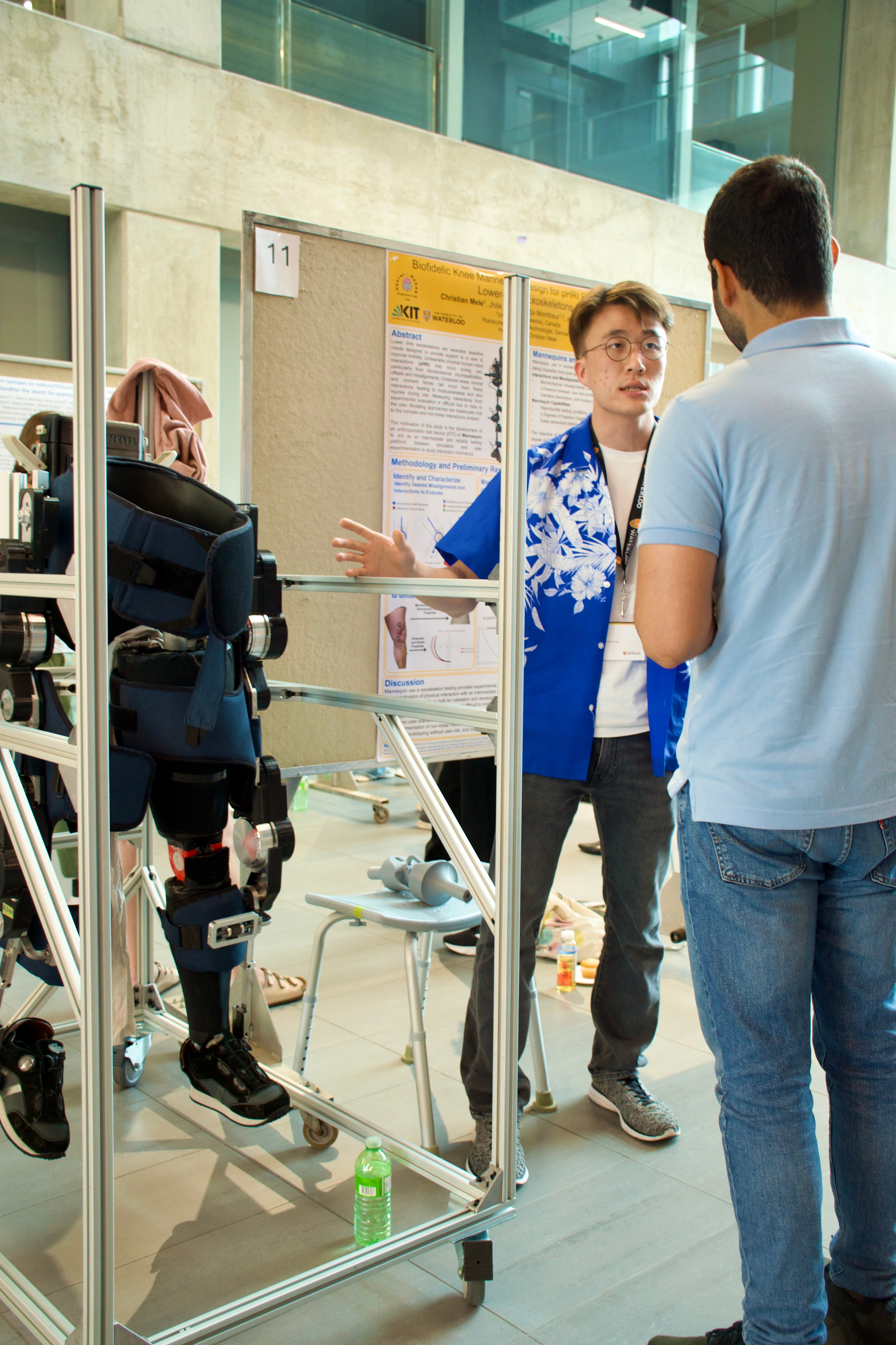 Graduate student with knee mannequin presenting research