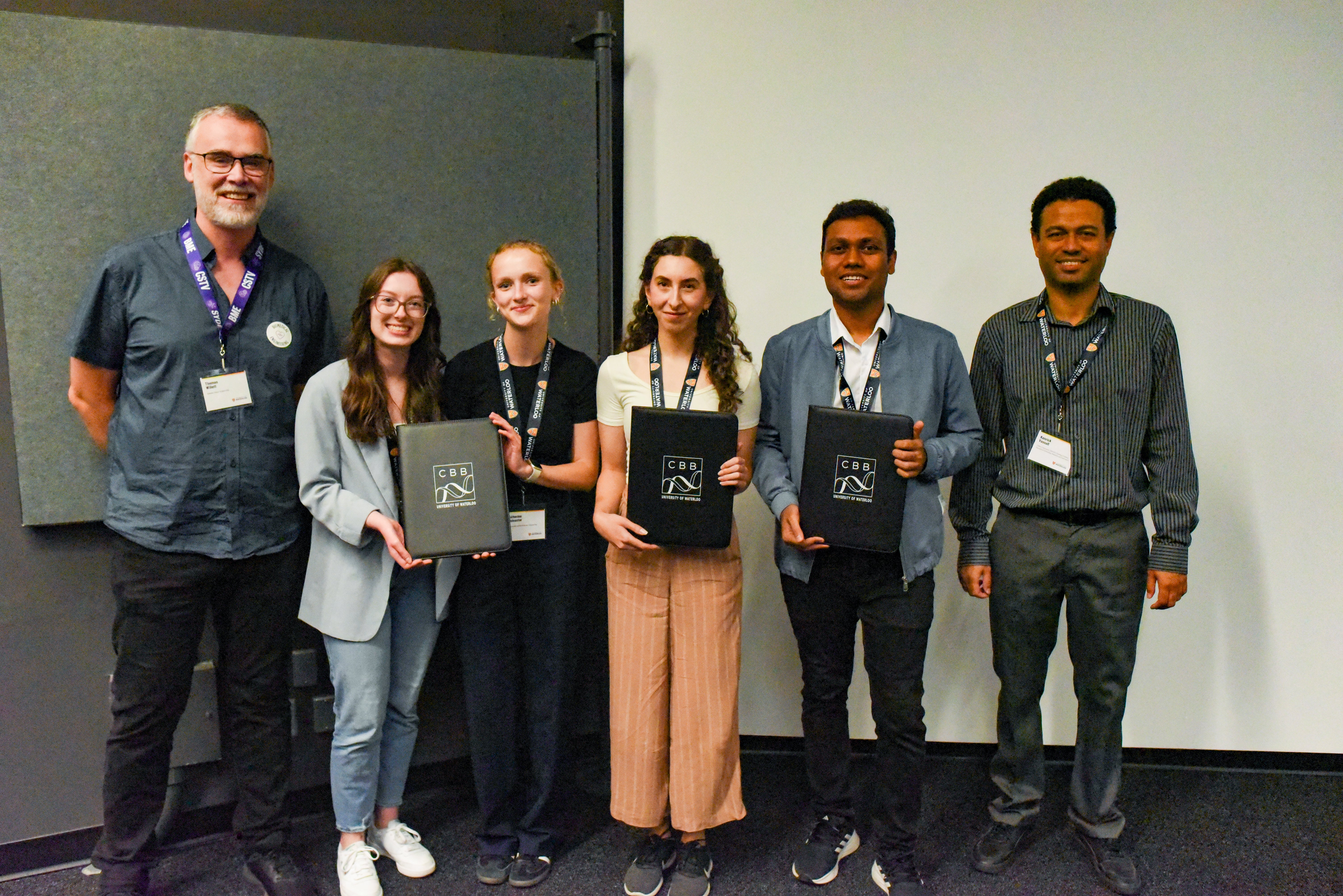 Professor Thomas Willet and Kenrick Vassall with winning graduate students