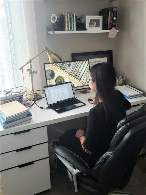 grad student working at home office