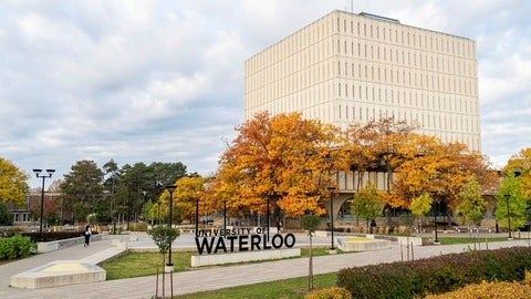 dana porter library with the waterloo logo in front