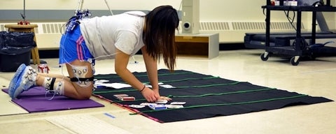 Participant performing prolonged kneeling task.