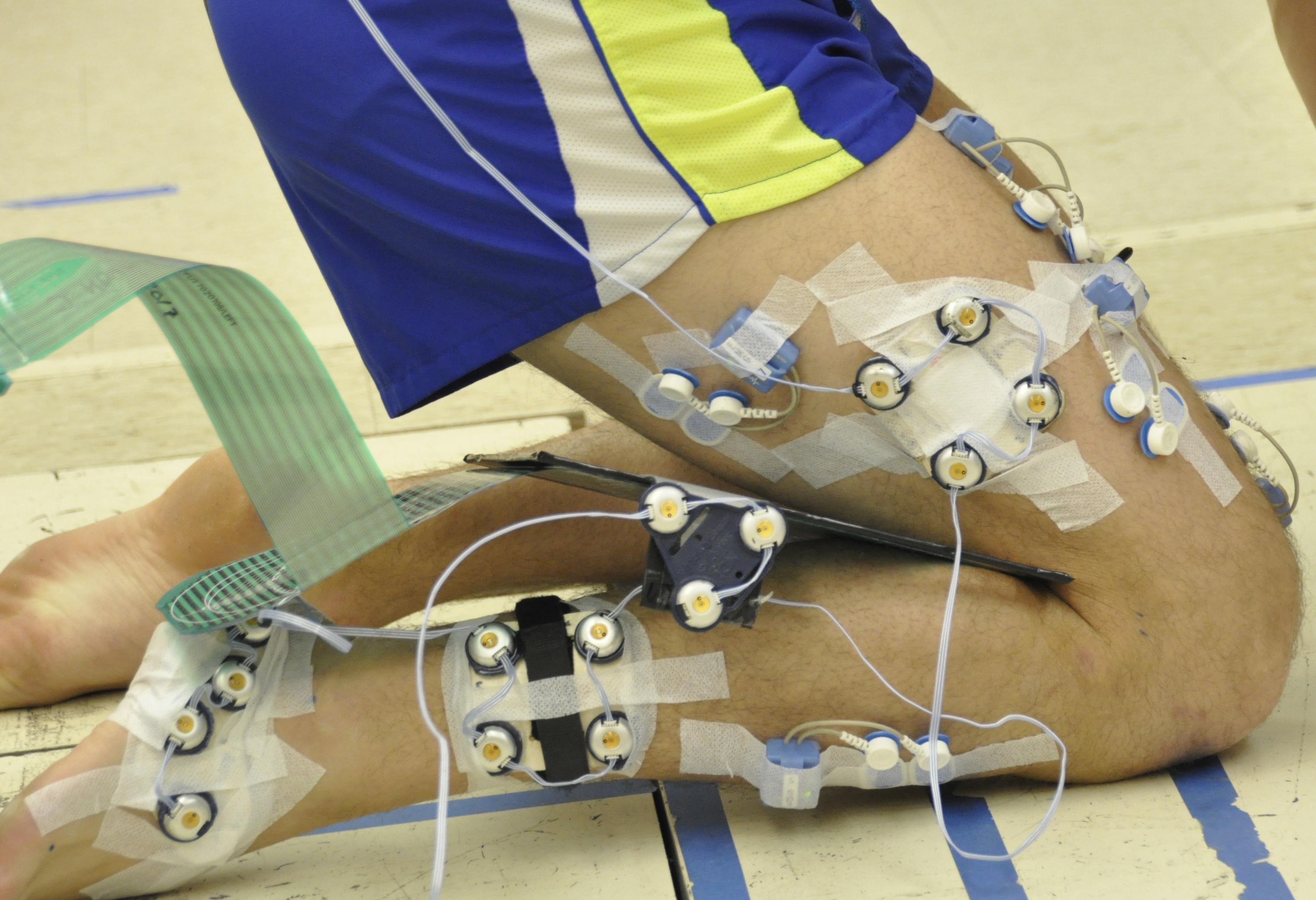 participant kneeling with motion, pressure, and emg equipment