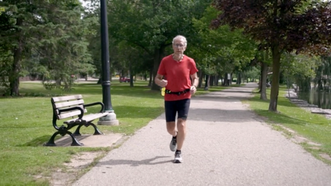 Older male going for a jog in a park