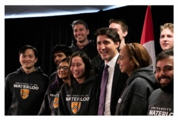 Students assemble for a photo with Prime Minister Trudeau.