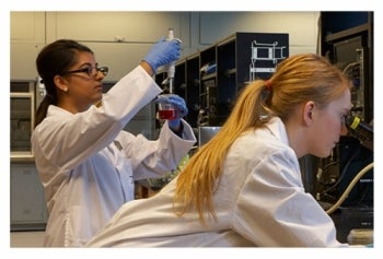 Two researchers work in a generic lab.