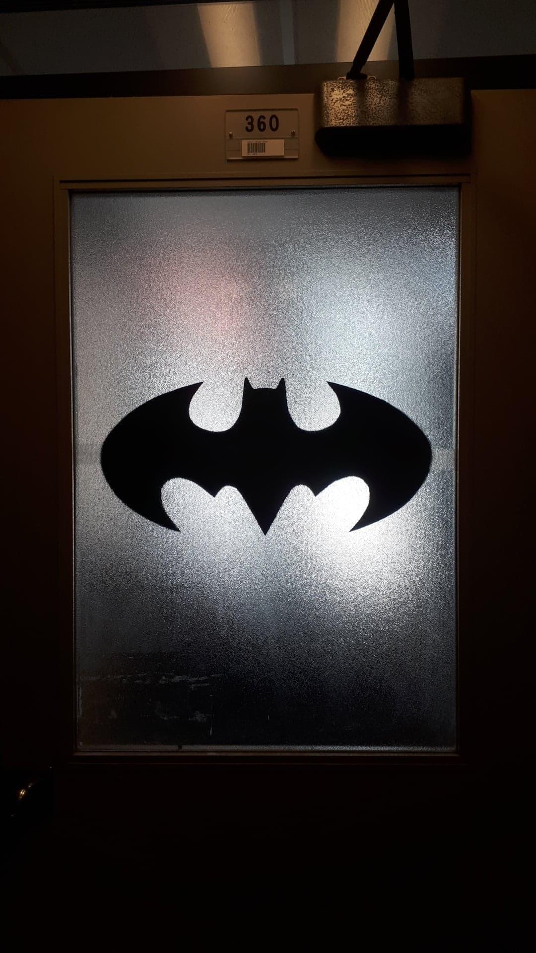 batman symbol on a door