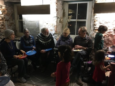 Home Routes community enjoying a potluck