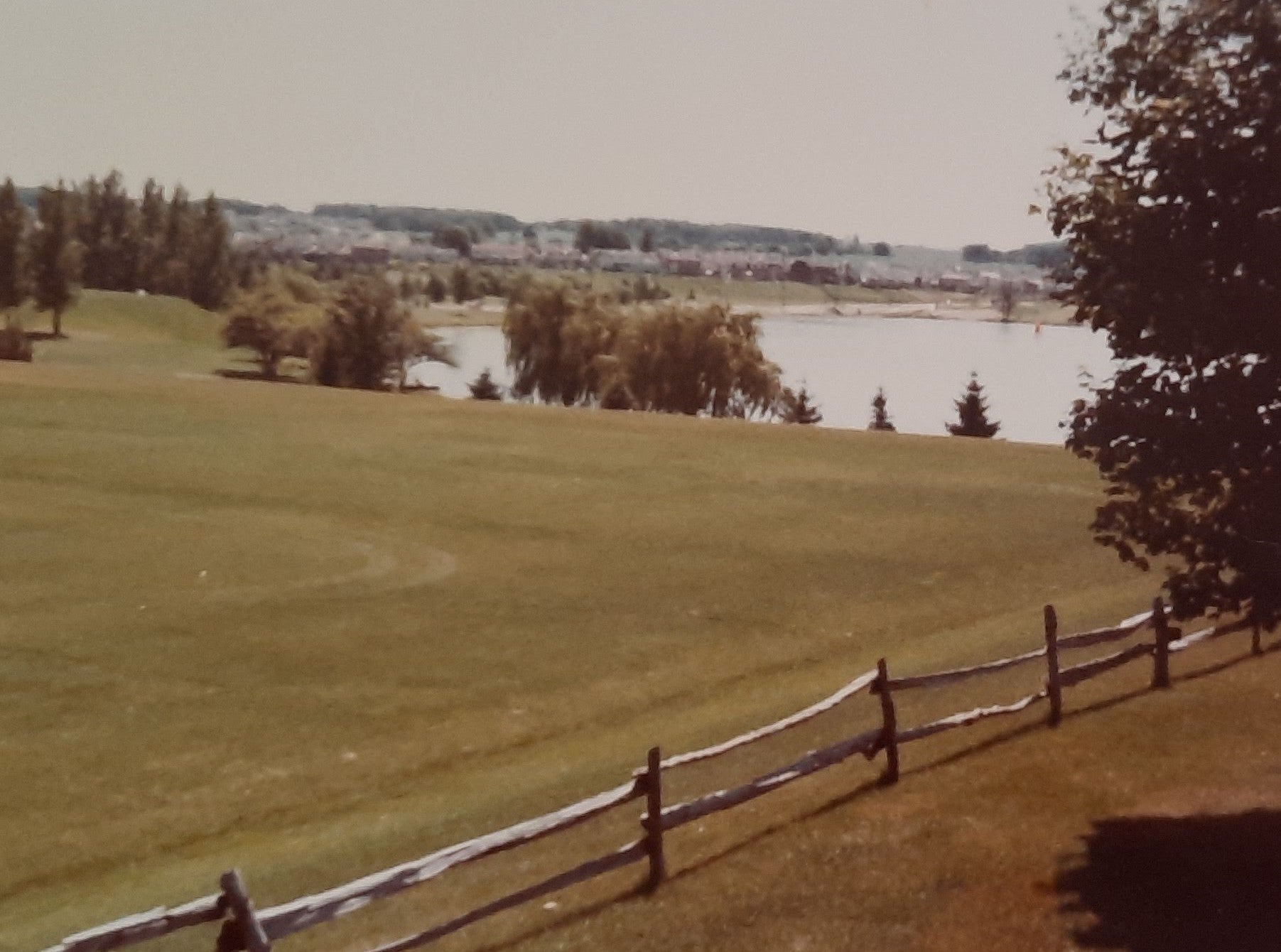 Vintage photo of the sports field, colombia lake in the background