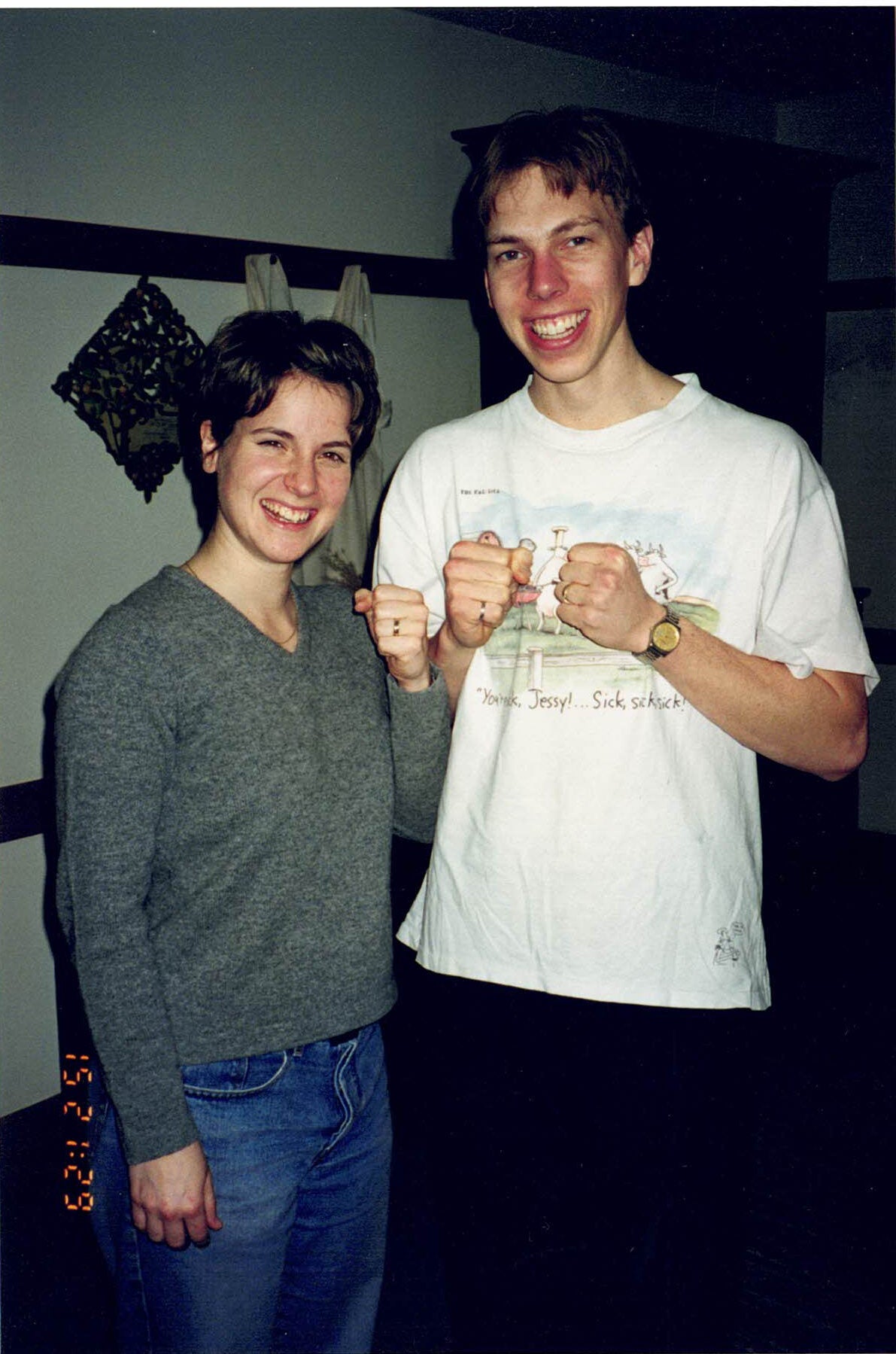 Colin and Jennie excitedly show off rings on their fingers!