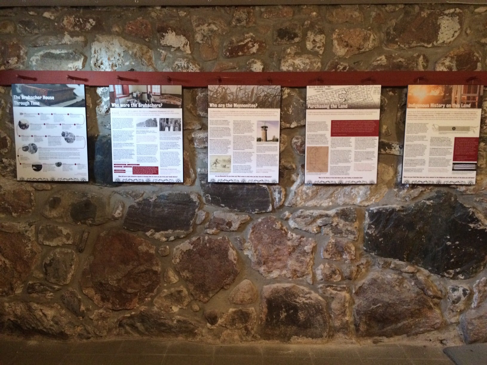 Five information panels hang in the Brubacher House basement.