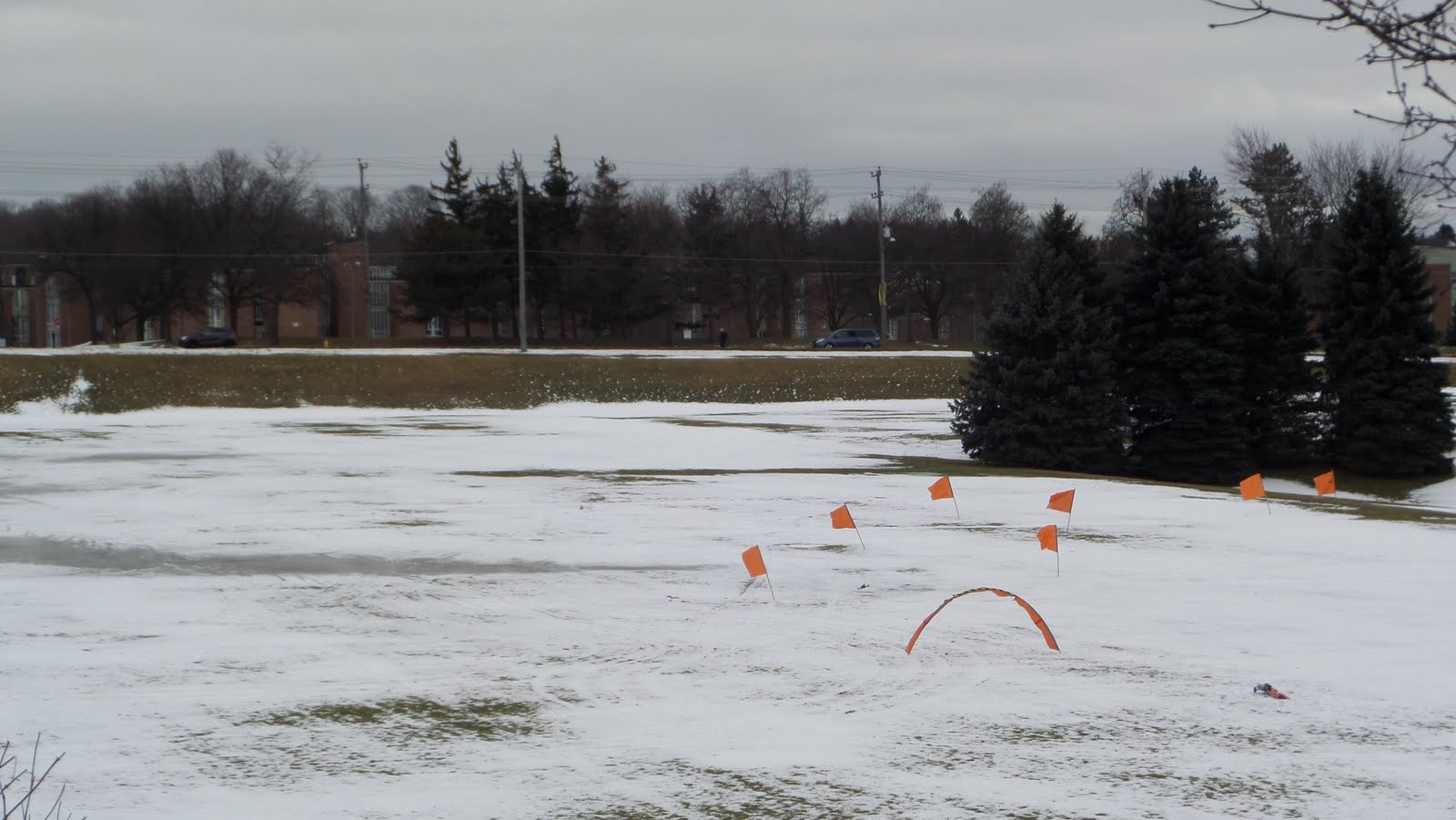 little flags are set up in the snow of Colombia fields.