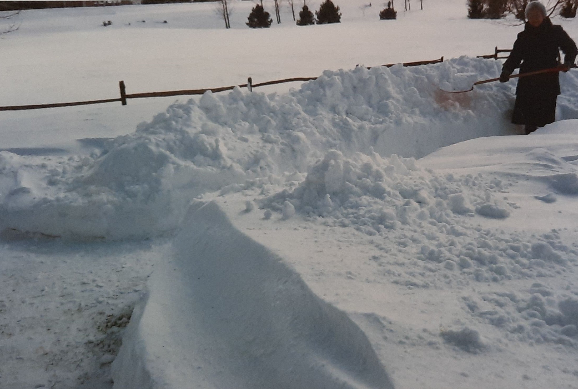 large snow drifts, and Dorothy shoveling