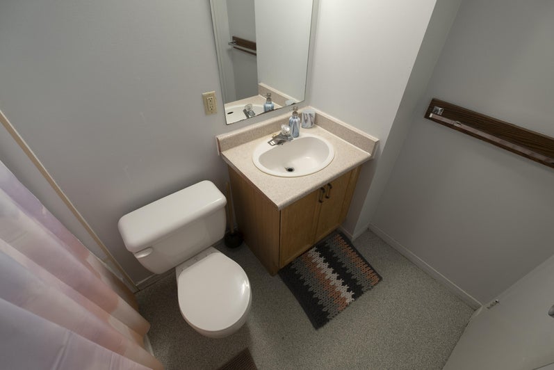 UWP suite washroom with toilet, sink and shower.