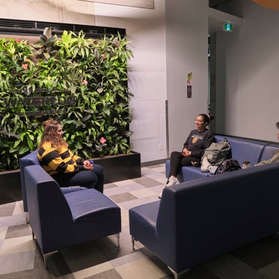 Claudette Millar Hall main floor seating area and plant wall