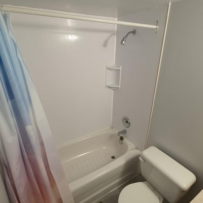 UWP suite washroom with toilet, sink and shower.