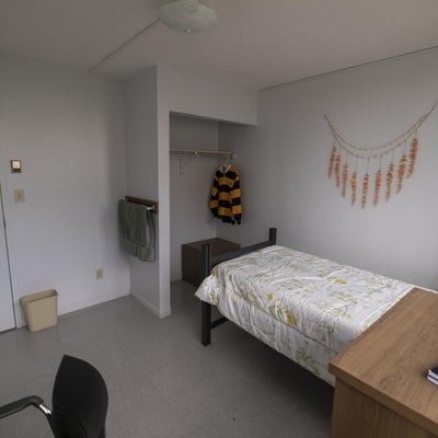 UWP single room showing twin bed and closet.