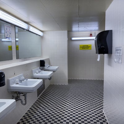 Village 1 washroom showing sinks and mirrors. 