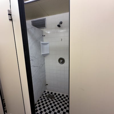 Village 1 shower stall with door.
