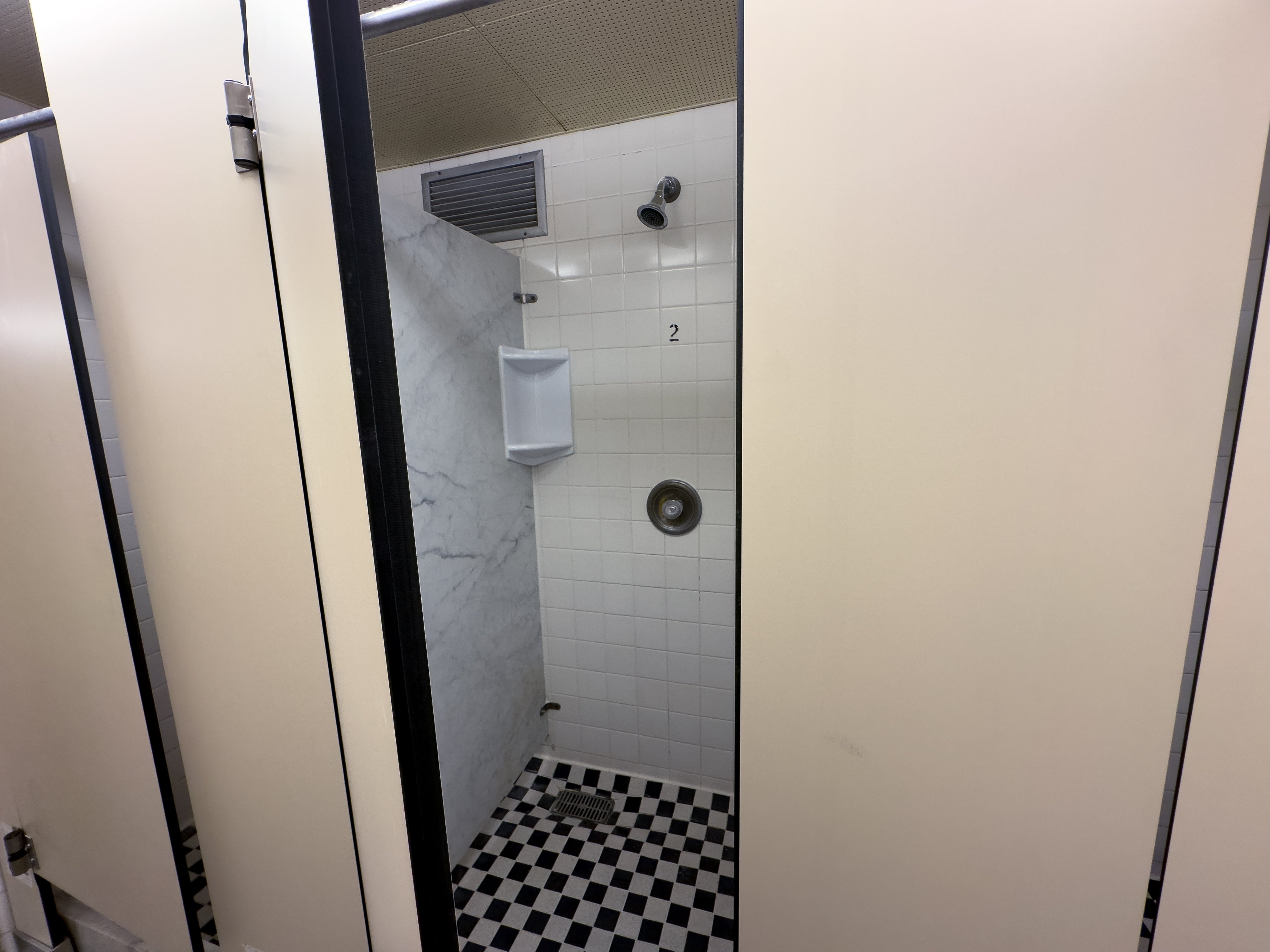 Village 1 shower stall with door.