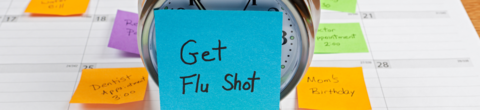 clock with get flu shot sticky note 