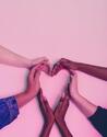 Many hands forming a heart