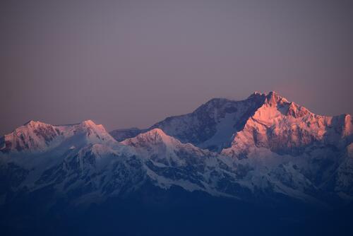 Snow-covered mountains at dusk