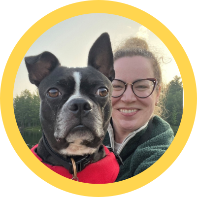 Boston terrier dog and woman wearing glasses 